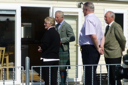 Prince Charles meets two occupants of a holiday home